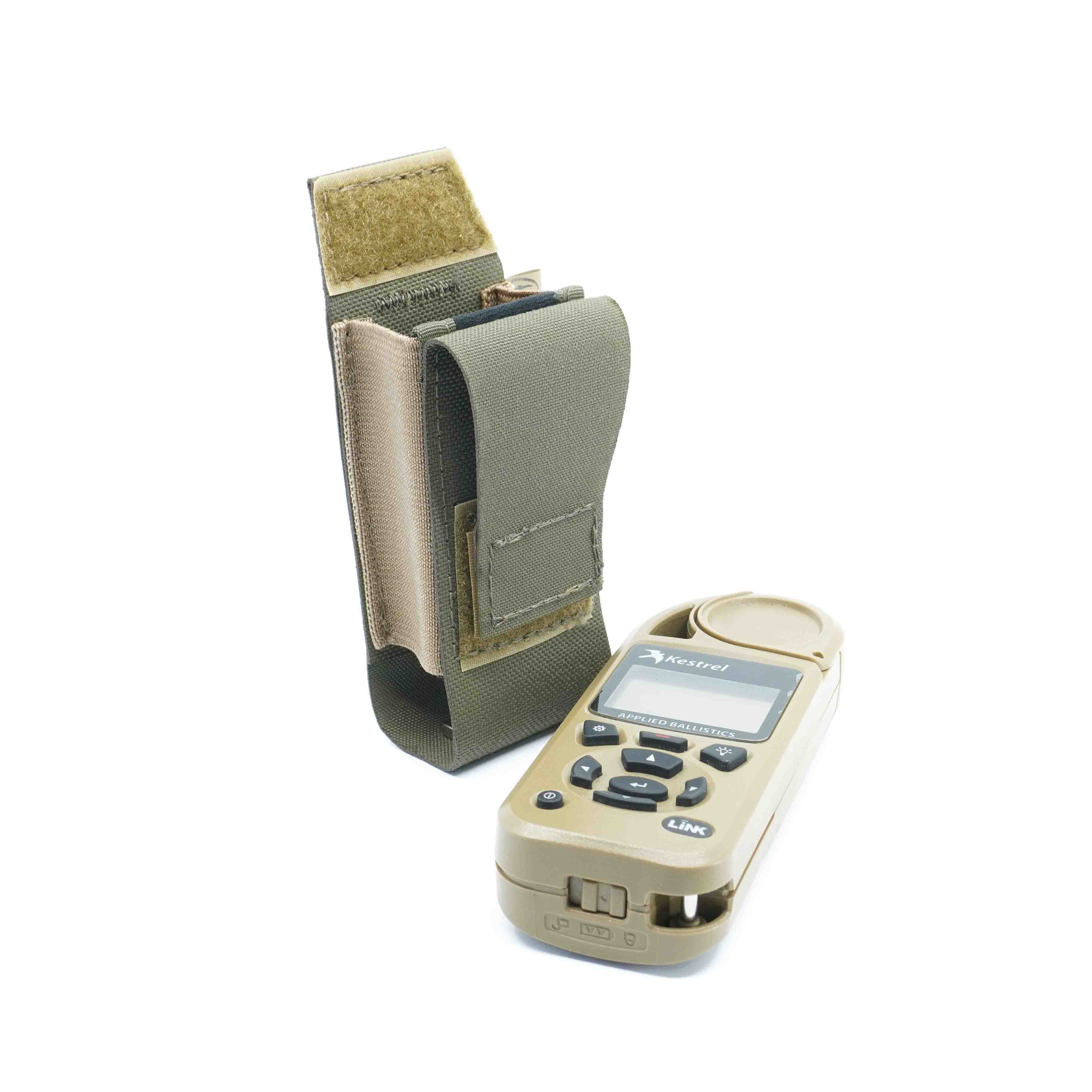 A ranger green Kestrel pouch made of Cordura laminate, featuring a Velcro fastening and an elastic side, displayed next to a Kestrel weather meter.